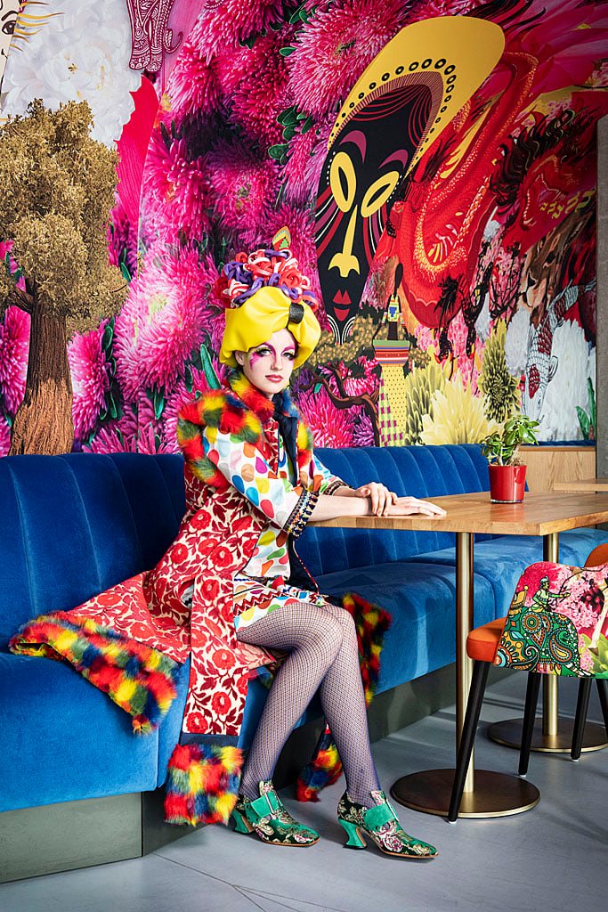 Model posing for Tilly Zegers in the context of David Zuker's murals for nhow Amsterdam Rai hotel.